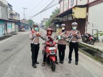 Polisi Bersama Masyarakat satlantas Polres Meranti Bagikan Masker Ke Pengguna jalan